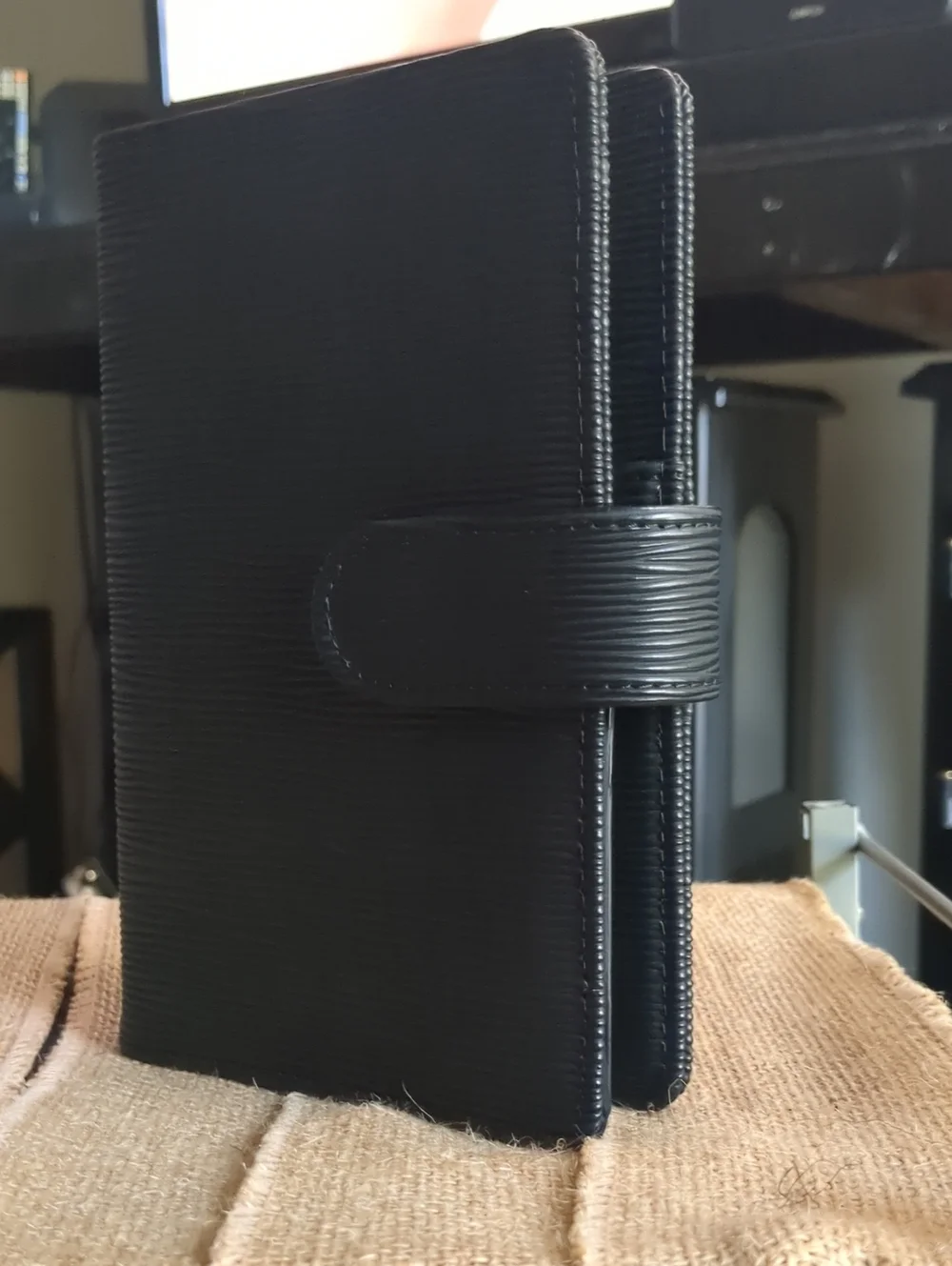A6 Saffiano Binder In Black With Gold Hardware.